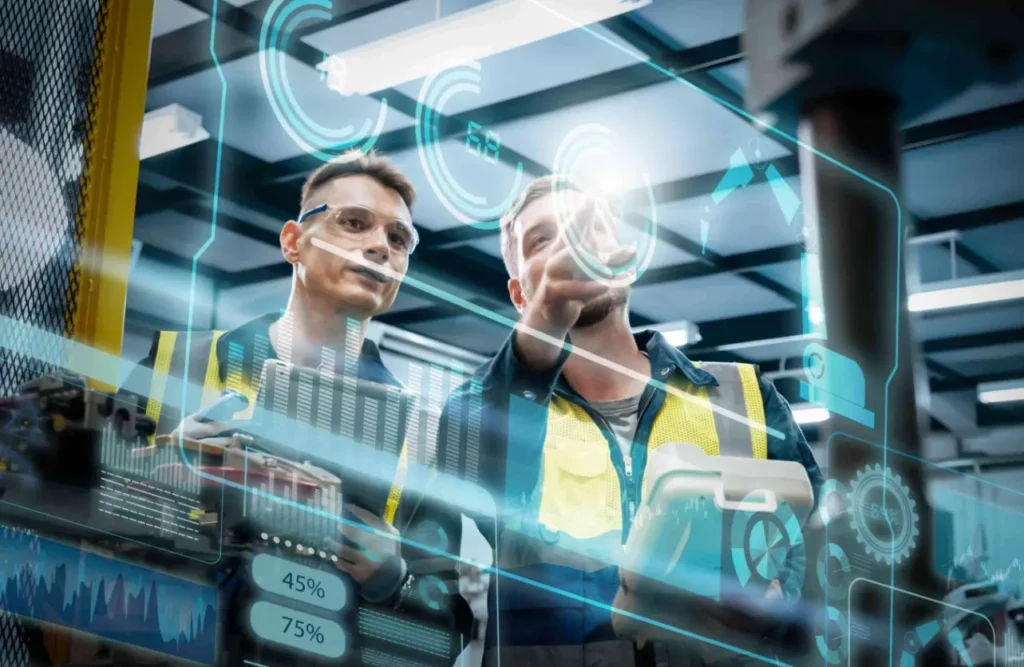 Manufacturing engineers using AI analytics and digital dashboards to optimize production in a smart factory environment