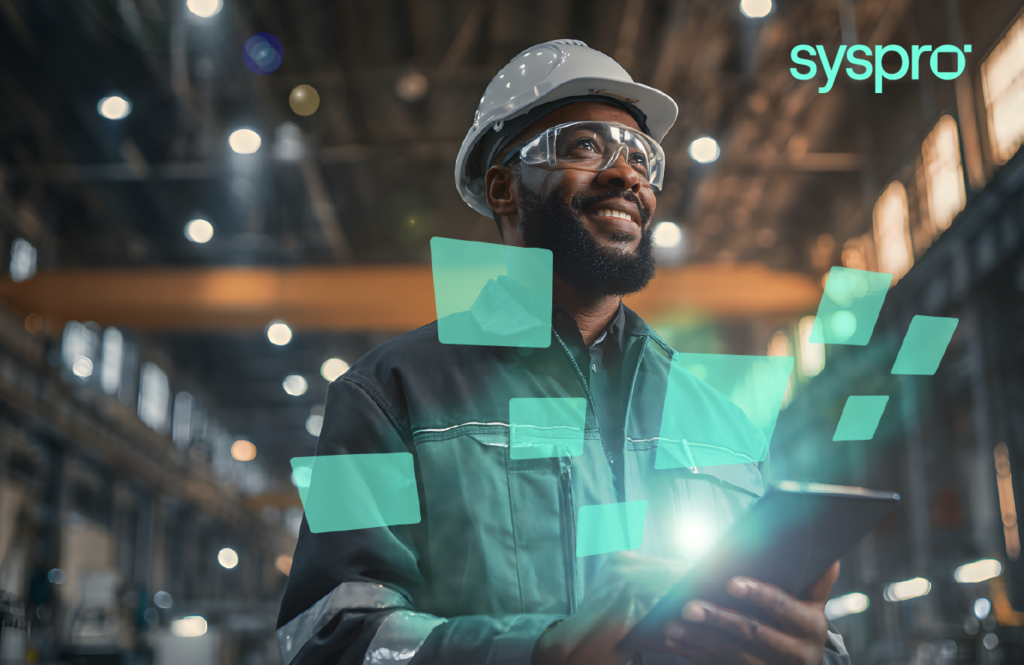 Manufacturing operations manager using Syspro modules ERP platform in warehouse to track production data and improve operational efficiency.