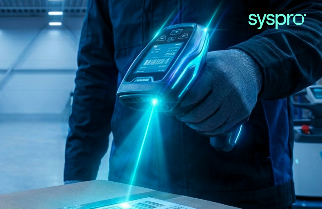 A warehouse worker in gloves using a handheld barcode scanner to track inventory in real time, representing Syspro Mobile Warehouse on the production floor.